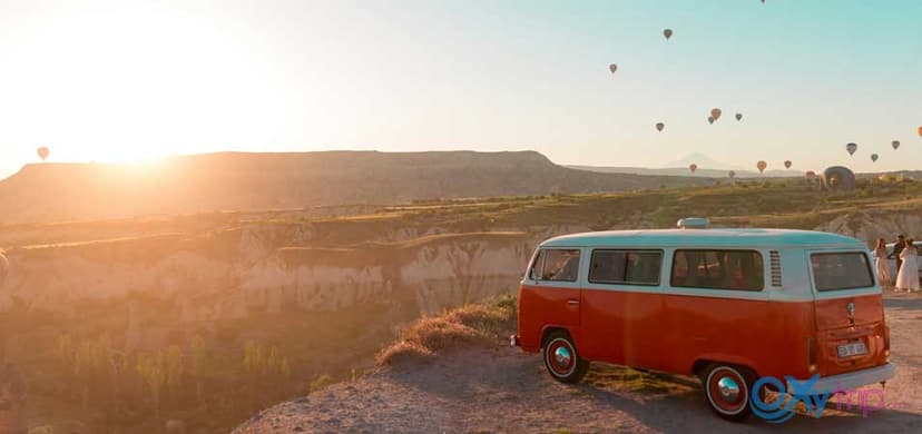 Hot air balloons flying over Cappadocia fairy chimneys landscape